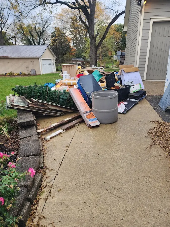 Dumpster being loaded with debris for 30 Yard Dumpster Rental in Glenburn